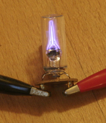 A starter glowing while heating up (click to enlarge).