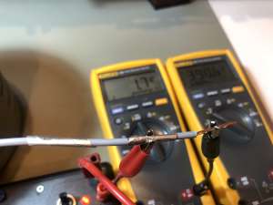 Picture of the measurement of the insulation from the outside to the inside and back to the outside of a PVC insulated wire. (click to enlarge)