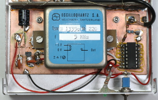 Picture of the TCXO (middle) with its 5 Vdc power supply (left) and buffer circuit (right). (click to enlarge)