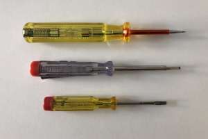Picture of three mains tester screwdrivers. The bottom one is an old one and its shaft is not insulated. (click to enlarge)