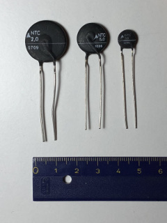 Three different sizes of NTC inrush current limiters. The cold resistance is directly marked on the body. (click to enlarge)