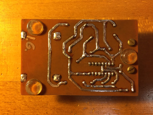This PCB has been hand drawn, and letter transfer has been used only for the pads of the DIL IC. The traces have been tinned with solder, mainly for esthetic reasons. (click to enlarge).