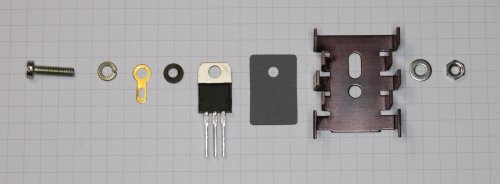 All the necessary component in the right order to mount a power transistor on a heat sink.