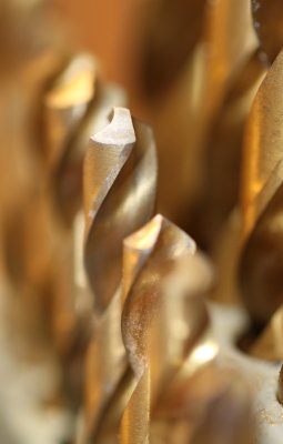 A box of twisted drill bits