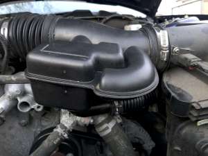 The intake duct reinstalled in the car with the adapter and sound pipe underneath. (click to enlarge)