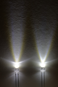 These 2 LEDs have the same chip producing the same luminous flux. The one on the left concentrates the light in a cone of 15° while the one on the right in an cone of 30 .